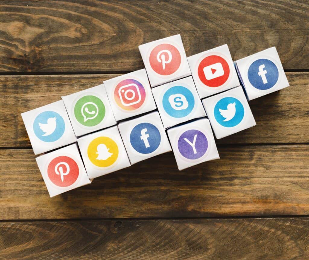 arrow made with boxes vivid social media icons wooden plank1